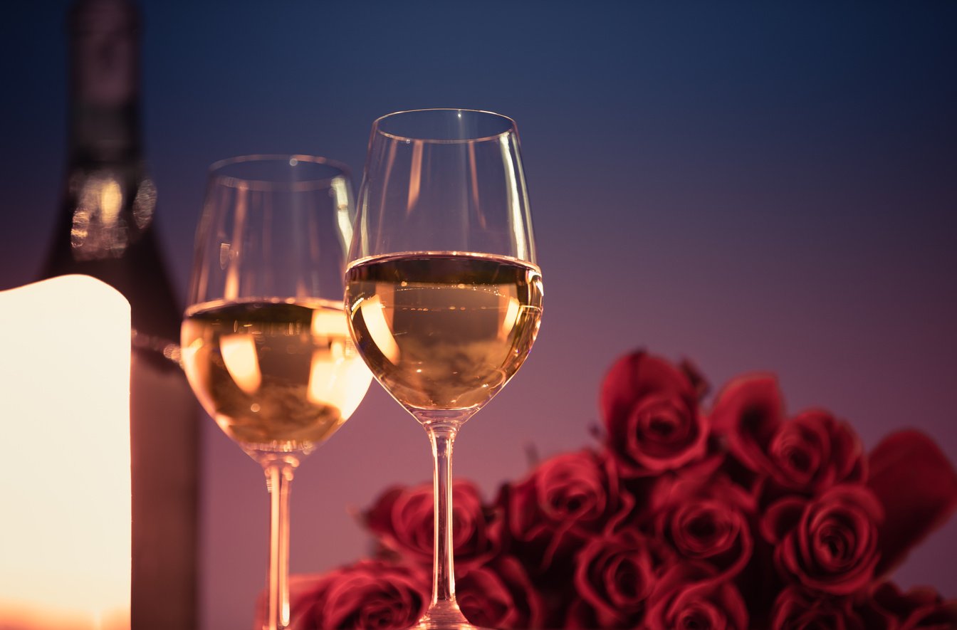 Wine and roses. Romantic dinner.